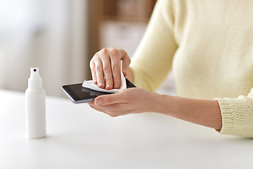 Image showing close up of woman cleaning smartphone