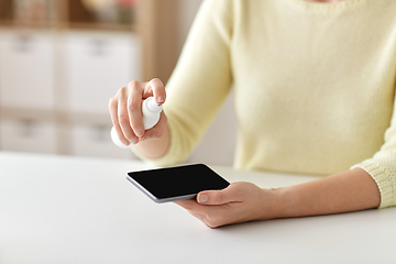 Image showing close up of woman hands cleaning smartphone