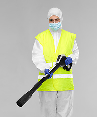 Image showing sanitation worker in hazmat with pressure washer