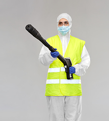 Image showing sanitation worker in hazmat with pressure washer