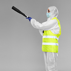 Image showing sanitation worker in hazmat with pressure washer