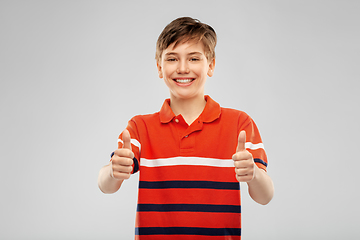 Image showing happy boy in red polo t-shirt showing thumbs up