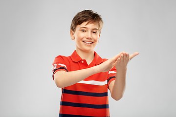 Image showing portrait of happy smiling boy applauding