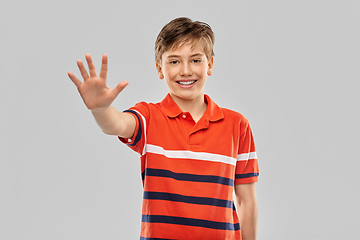 Image showing portrait of happy smiling boy showing five fingers