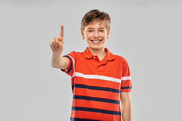 Image showing portrait of happy smiling boy showing one finger