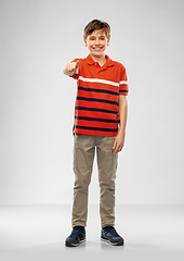 Image showing portrait of smiling boy pointing finger to camera