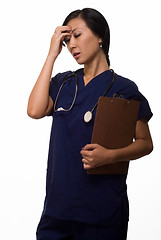 Image showing Health care worker with a headache