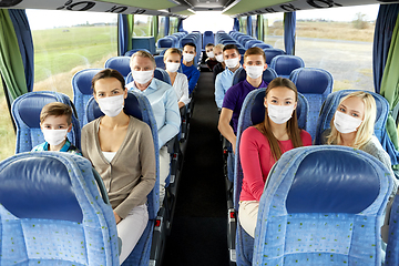 Image showing group of passengers in masks travelling by bus