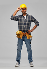 Image showing happy indian builder in helmet with tool belt