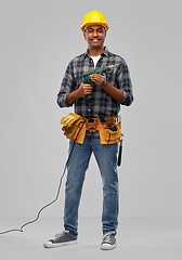 Image showing happy indian builder in helmet with electric drill