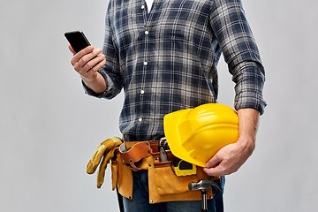 Image showing worker or builder with phone and working tools