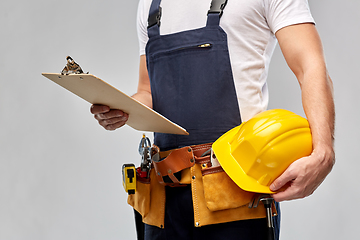 Image showing male builder with clipboard and working tools