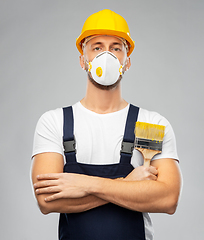 Image showing male worker or builder in helmet and respirator