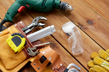 Image showing different work tools on wooden boards