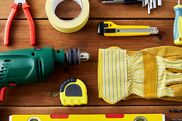 Image showing different work tools on wooden boards