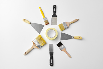 Image showing different size paint brushes and putty knives