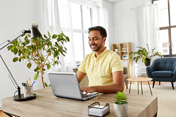 Image showing indian man with laptop working at home office