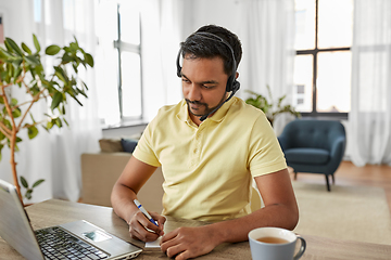 Image showing indian man with headset and laptop working at home