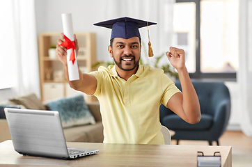 Image showing indian student with laptop and diploma at home