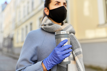 Image showing woman in reusable mask with tumbler in city