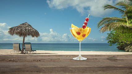 Image showing Summer refreshing cocktail with sea or ocean beach on background