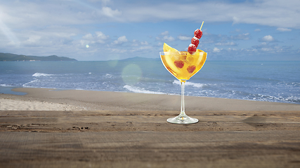 Image showing Summer refreshing cocktail with sea or ocean beach on background