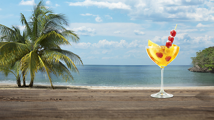 Image showing Summer refreshing cocktail with sea or ocean beach on background