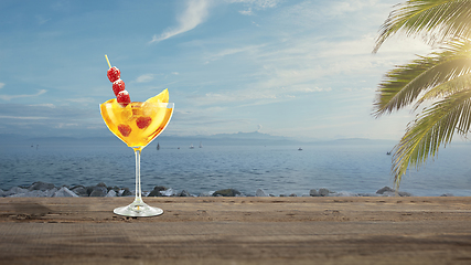 Image showing Summer refreshing cocktail with sea or ocean beach on background