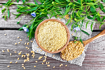 Image showing Bran flaxseed in bowl on board top