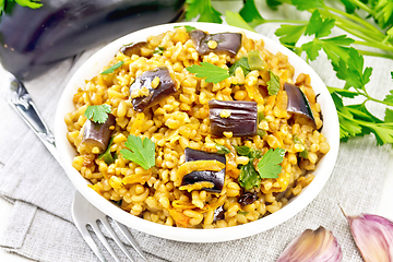 Image showing Bulgur with eggplant in bowl on board