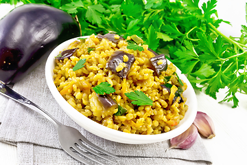 Image showing Bulgur with eggplant in bowl on light board