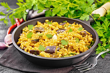 Image showing Bulgur with eggplant in pan on board