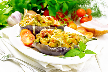 Image showing Eggplant stuffed smoked brisket and vegetables in plate on light