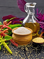 Image showing Flour amaranth in bowl and oil on table