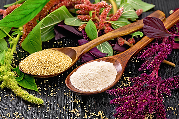 Image showing Flour and seeds amaranth in two spoons on board