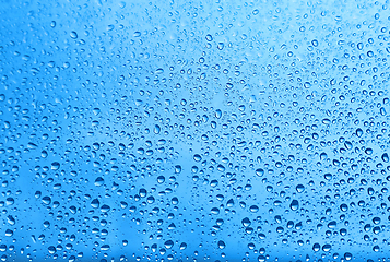 Image showing Water drops on glass, natural blue texture