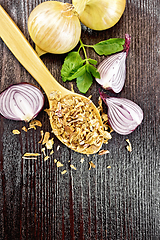 Image showing Onion flakes in spoon on board top