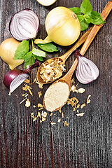 Image showing Onion powder and flakes in spoons on dark board top