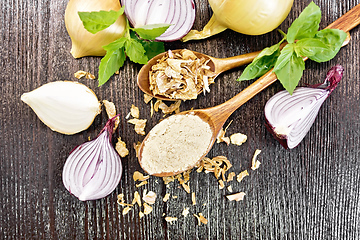 Image showing Onion powder and flakes in spoons on wooden board top