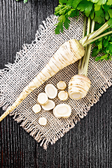 Image showing Parsley root chopped on dark board top