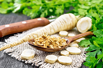 Image showing Parsley root dried in spoon on dark board