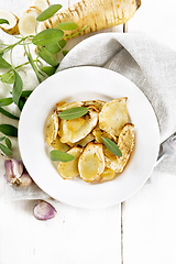 Image showing Parsnips baked in plate on light board top