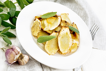 Image showing Parsnips baked in plate on white wooden board