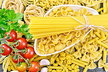 Image showing Pasta different with bowl and tomatoes on board top