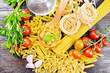 Image showing Pasta different with oil and tomatoes on table top