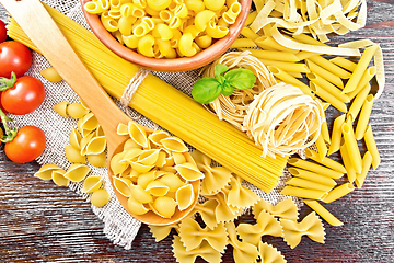 Image showing Pasta different with tomatoes on board top