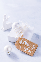 Image showing Christmas ornaments and small present in white