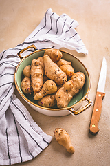 Image showing Raw topinambour in bowl on kitchen table