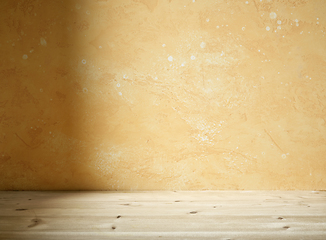 Image showing yellow wall and wooden table