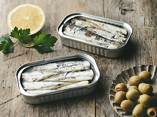 Image showing open sardines cans